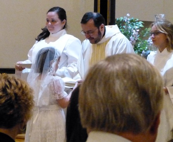 Receiving her own copy of the Gospel